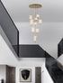 Bethel International 9 Light Flushed in Brass Dimmable LED Chandelier With Hanging Clear PC shades Model: GL454C24BR